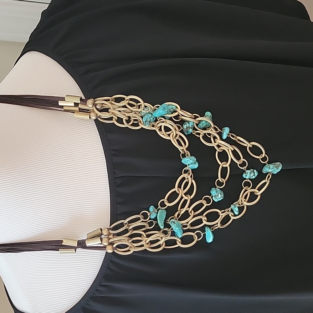 Bronze and Turquoise layered necklace with brown suede. Worn once. Beautiful on.